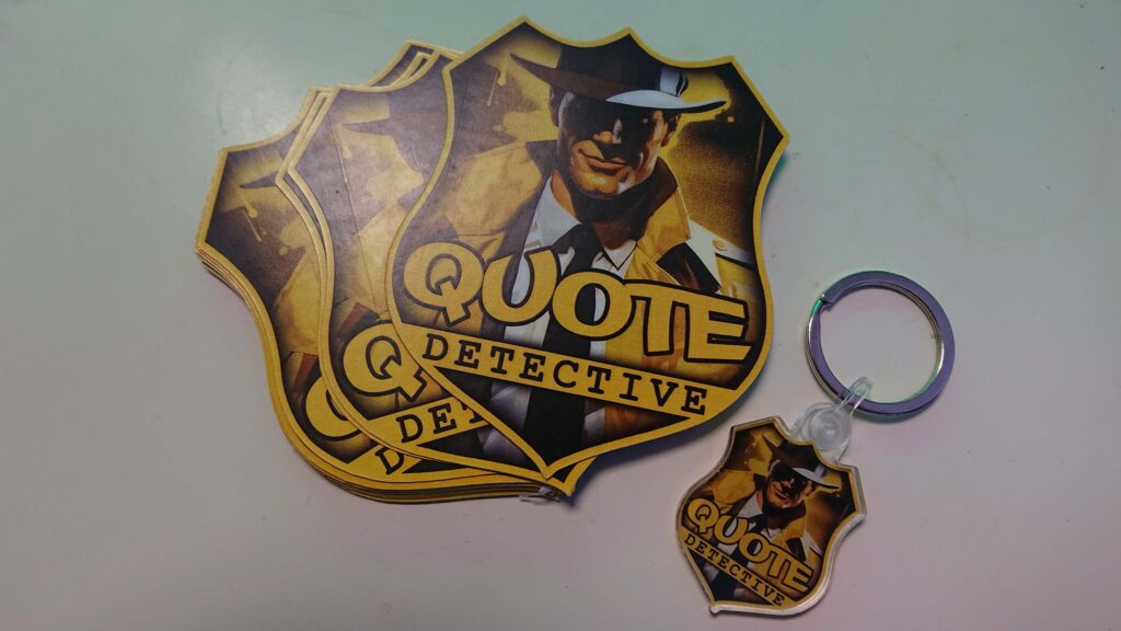 Custom-shaped Hoopsy business cards for Quote Detetcive